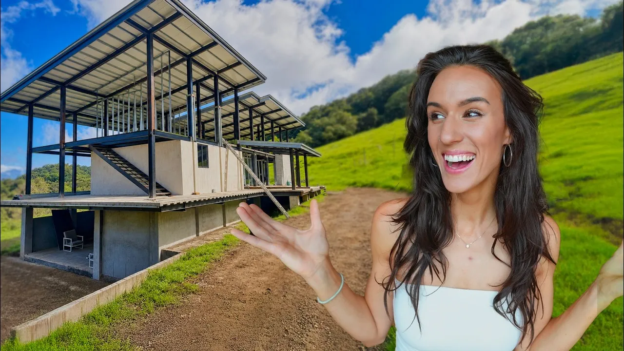 Kaylee in front of house under construction