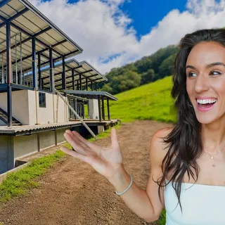 Kaylee in front of house under construction